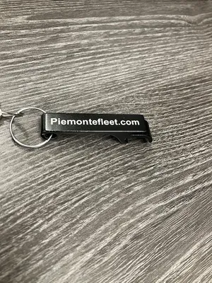 Bottle openers we got to give out to customers at fleet expos that features our website PiemonteFleetcom