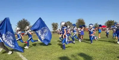 Rectangle Flag - Running through the tunnel after a big win Sanger Spartans youth football and cheer