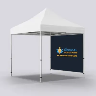 A white trade show tent with a blue back wall displays the text 'MEDICAL SOLUTIONS WE TAKE YOUR GOOD CARE' alongside a logo featuring a heart and a cross.