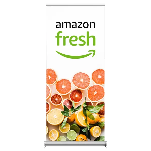 A retractable banner displaying 'Amazon Fresh' logo above vibrant citrus fruit slices, suggesting freshness and healthy produce for marketing purposes.